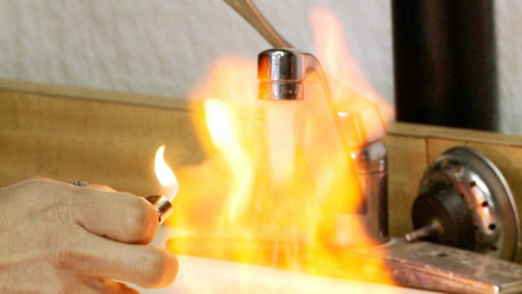A scene from the movie Gasland that shows water able to be lit on fire. A scene from the movie Gasland that shows water able to be lit on fire.